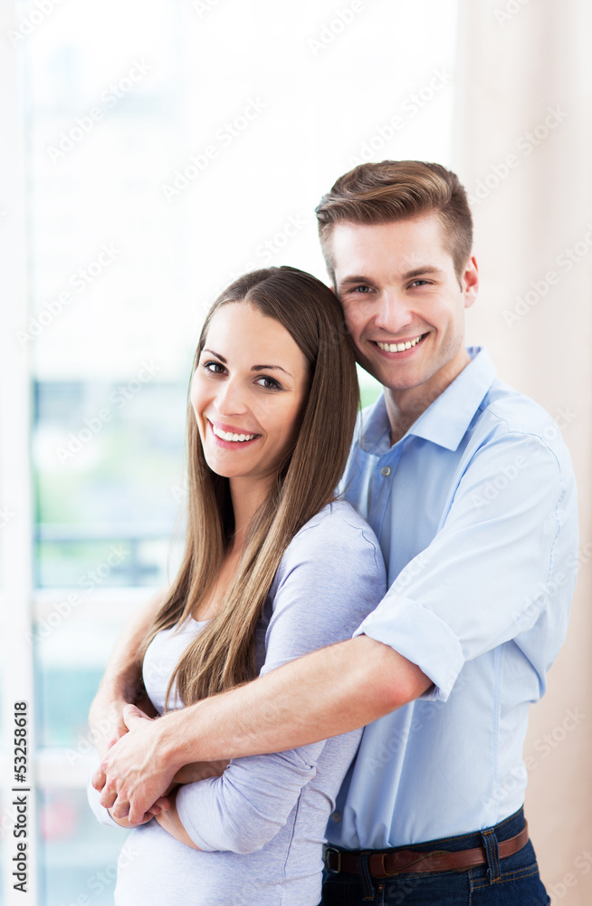 Fototapeta premium Young couple hugging
