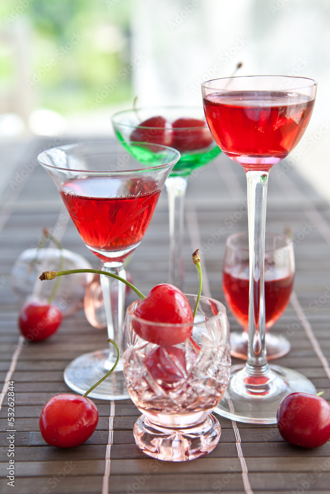 Various little glasses with cherry liquor Various little glasses with cherry liquor