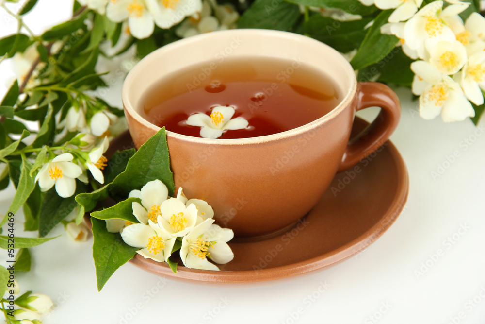 Cup of tea with jasmine, isolated on white Cup of tea with jasmine, isolated on white