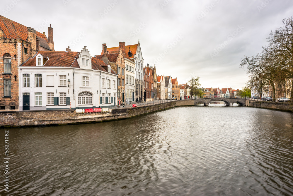 Canal, street and houses in Bruges, Belgium