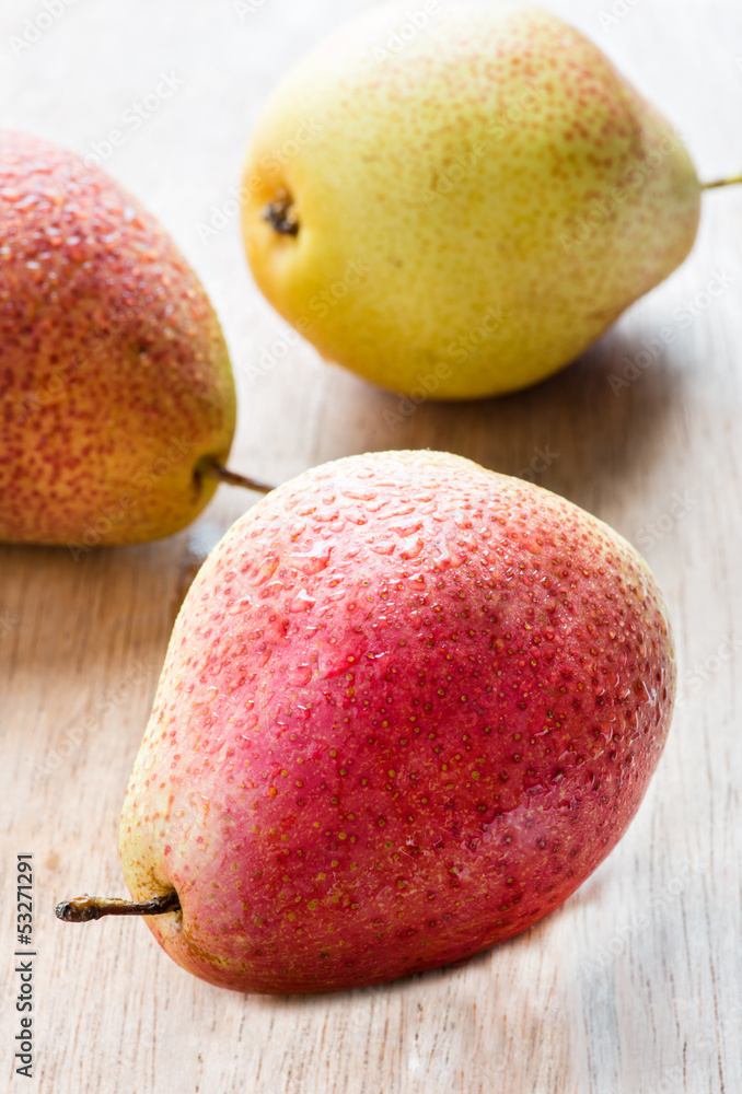 Fresh red pears over wooden background Fresh red pears over wooden background