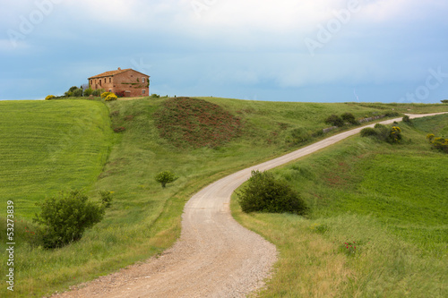 Tuscany farmhouse with lightning at horizon, Pienza, Italy