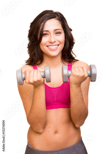 Attractive fitness woman lifting weights