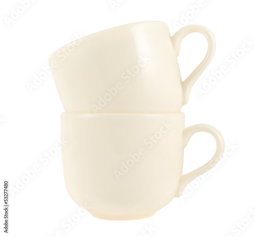 Ceramic cream colored cup pile isolated