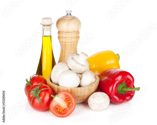 Fototapeta Naklejka Na Ścianę i Meble -  Fresh vegetables and mushrooms with olive oil and pepper shaker
