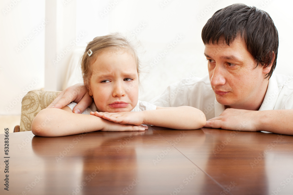 Father comforts a sad girl Father comforts a sad girl