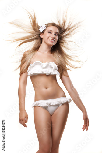 Happy woman in swimwear with blowing hair isolated