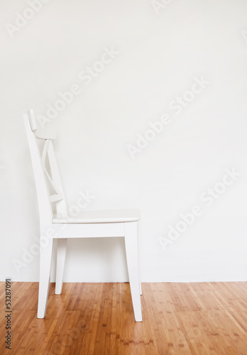 Empty interior with white wooden chair