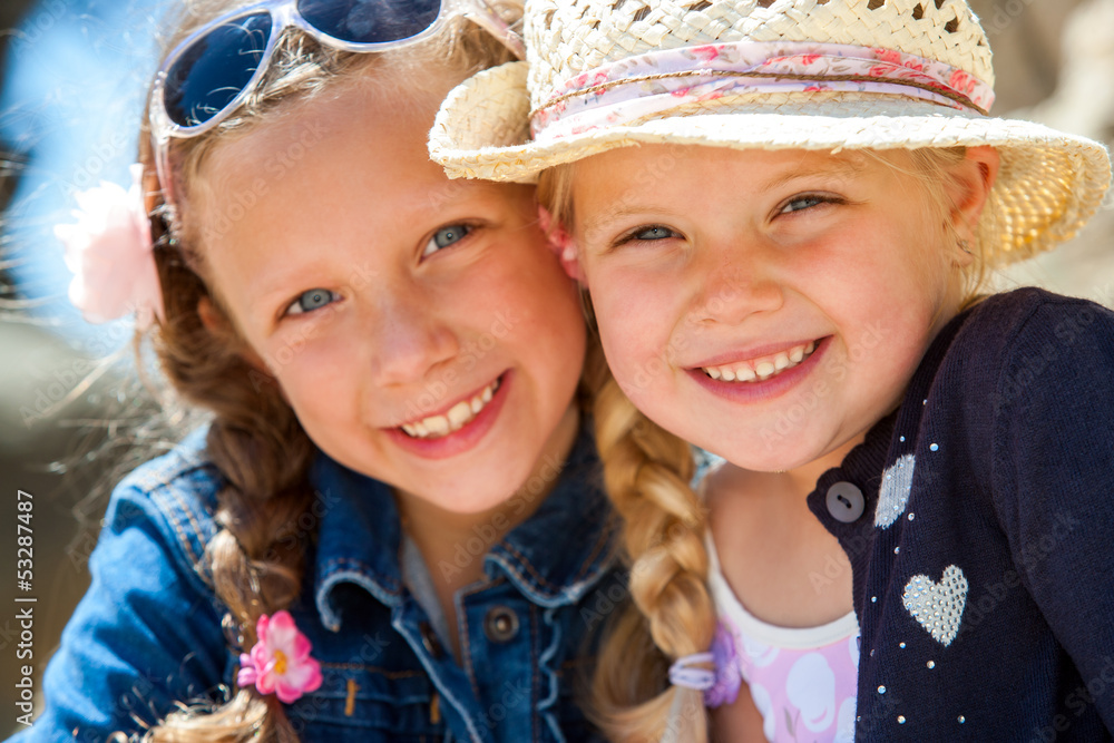 Two girls smiling together. Two girls smiling together.