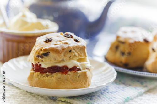 Traditional afternoon tea with scones, jam and cream