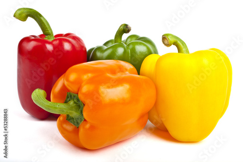 Foto Bell Peppers over a white background.