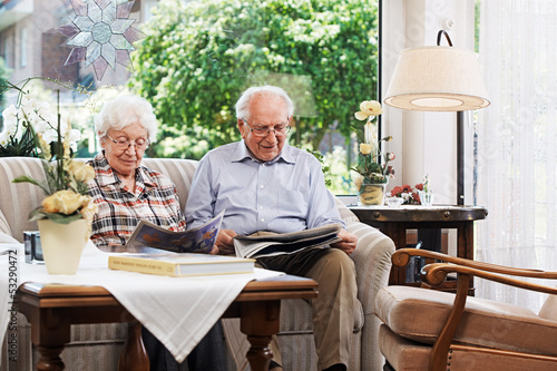 Senior couple reading the newspaper