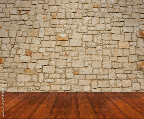 Wooden floor with stone wall