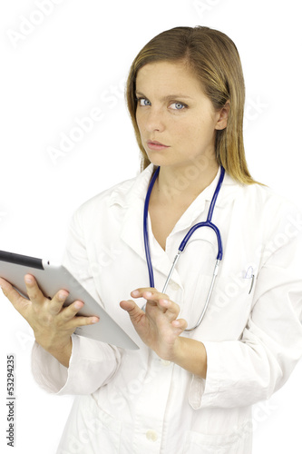 Fototapeta Naklejka Na Ścianę i Meble -  Beautiful female doctor working with tablet