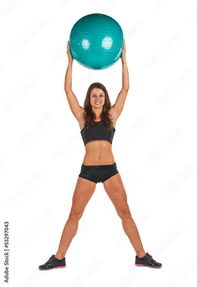 Young woman in the studio with fitness ball