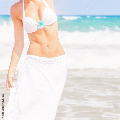 Slim female on the beach
