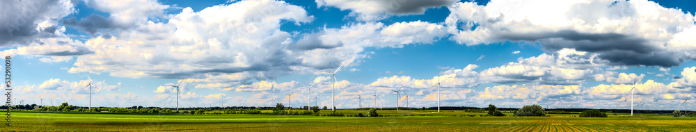 Wind power plants on field panorama Wind power plants on field panorama