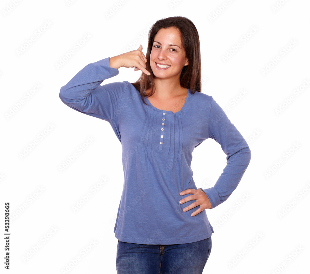 Beautiful woman gesturing call me sign with hand Beautiful woman gesturing call me sign with hand