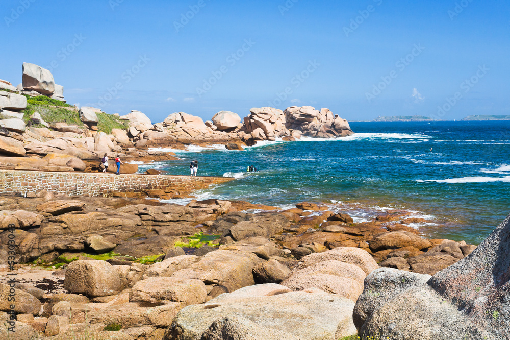 tourists on Pink Granite Coast in Brittany