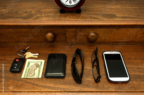 Man's Pocket Items on Dresser photo