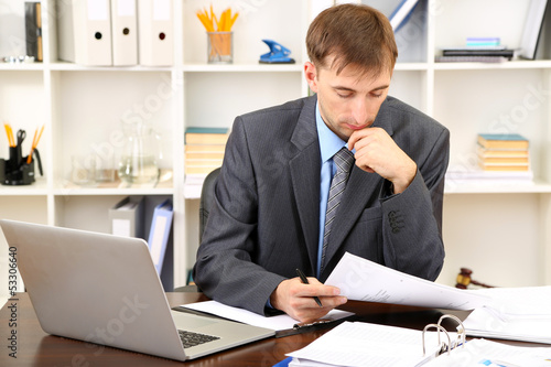 Young businessman in office...