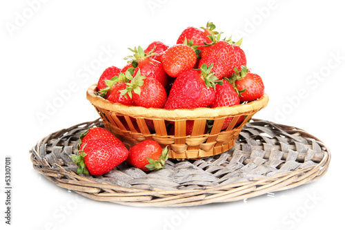 Fresh strawberry in wicker basket isolated on white