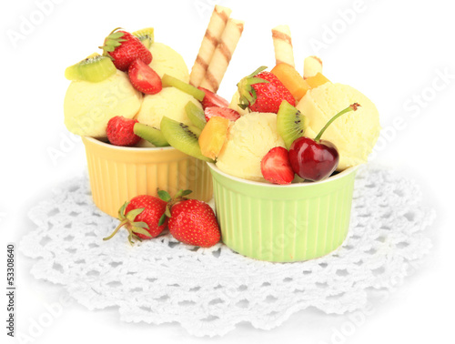 Delicious  ice cream with fruits and berries in bowl isolated