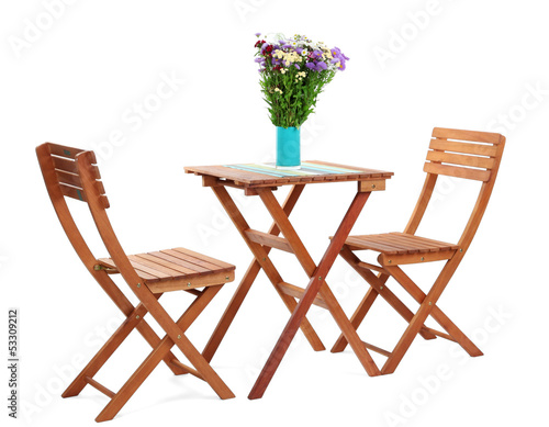 Wooden table with flower isolated on white