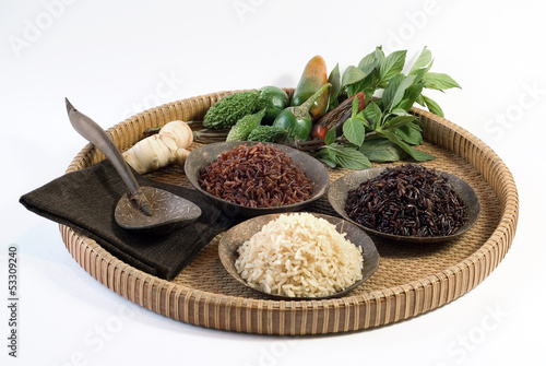 4 bowls of raw rice  brown  red  black  and black sweet rice