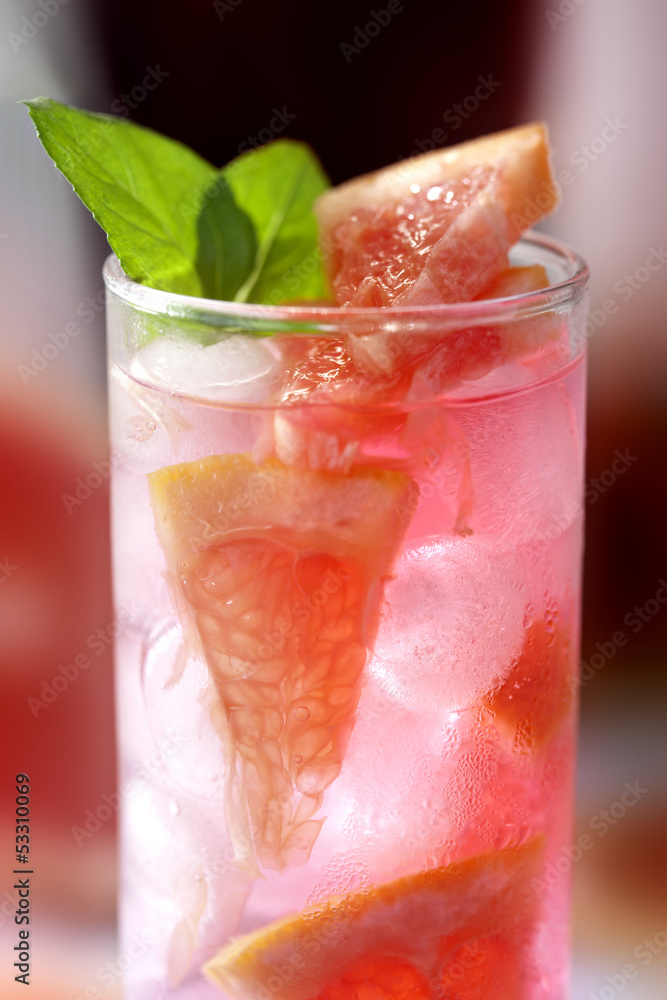 Fresh and cold ice tea with sliced grapefruit and mint Fresh and cold ice tea with sliced grapefruit and mint