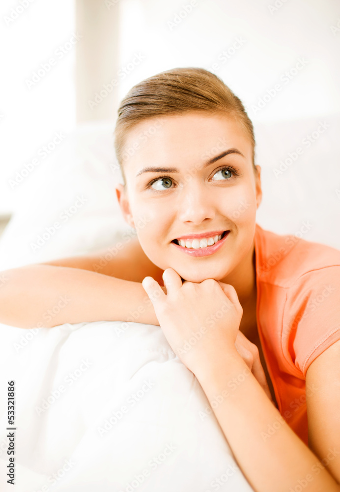 smiling woman lying on the couch smiling woman lying on the couch