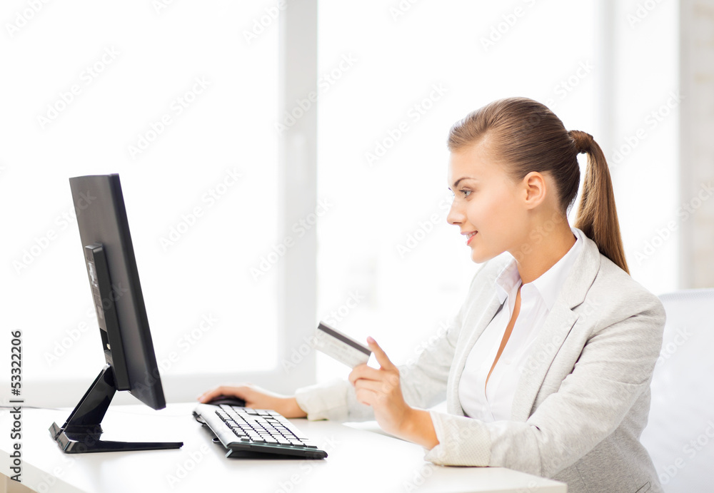 businesswoman with computer using credit card businesswoman with computer using credit card