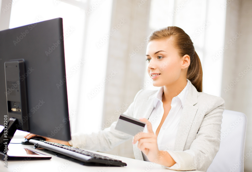 businesswoman with laptop using credit card businesswoman with laptop using credit card