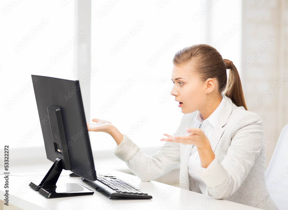 stressed student with computer in office stressed student with computer in office