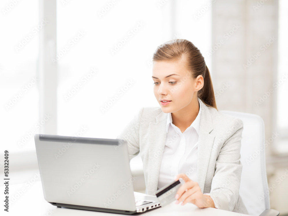businesswoman with laptop using credit card businesswoman with laptop using credit card