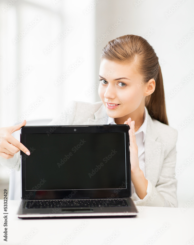 businesswoman with laptop in office