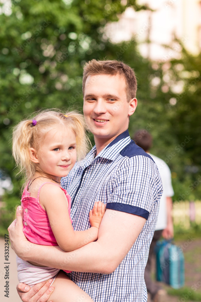 Happy father and daughter playing in the park Happy father and daughter playing in the park
