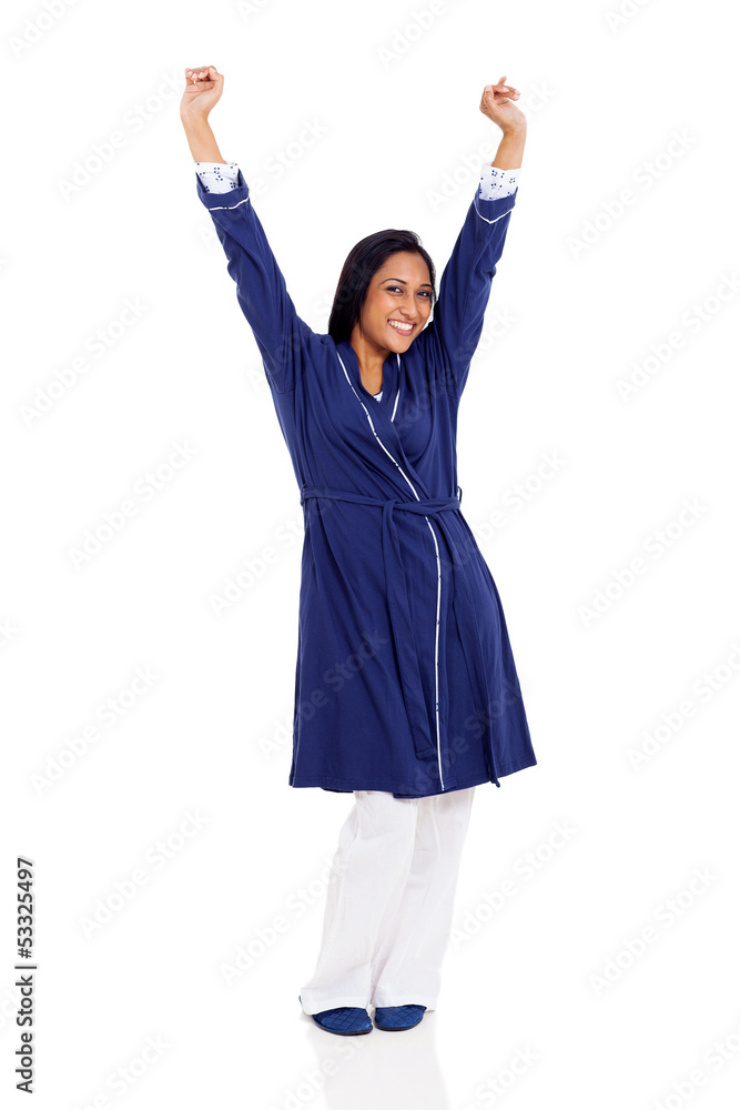 indian woman in pajamas stretching in the morning indian woman in pajamas stretching in the morning