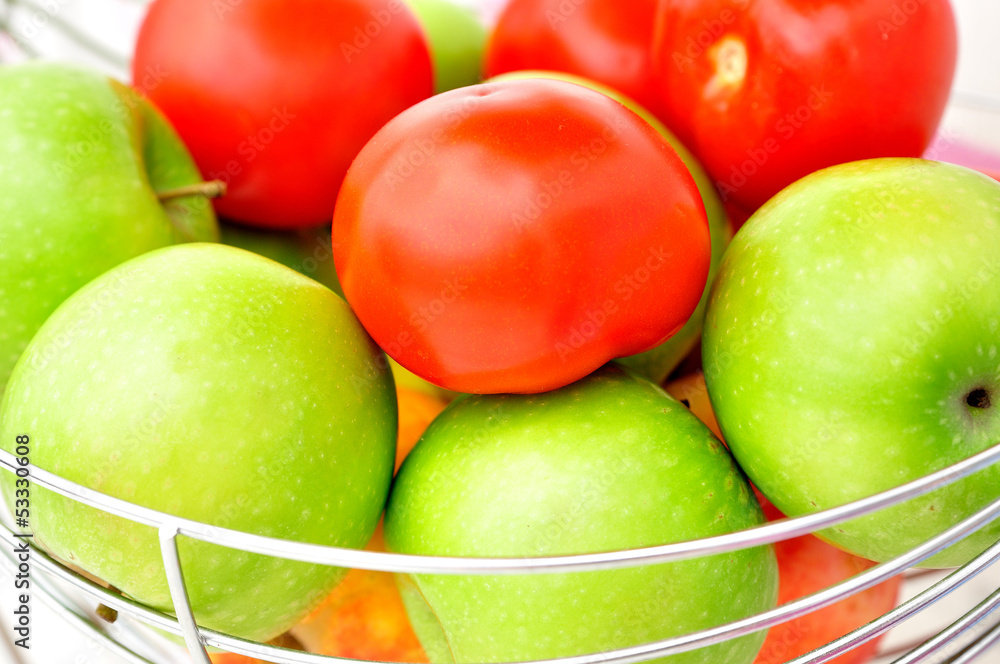 Green apples and red tomatoes. Green apples and red tomatoes.