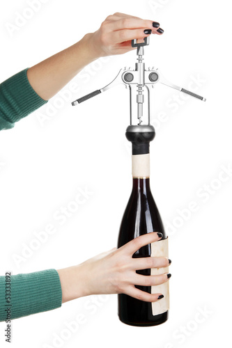 Opening of red wine corkscrew isolated on white