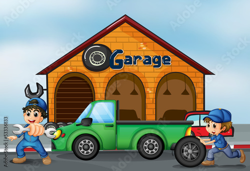 Two boys repairing a truck
