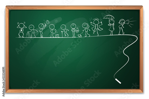 A chalkboard with a drawing of children