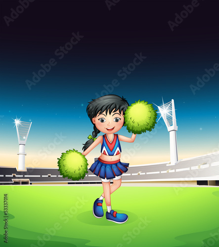 A cheerleader performing in the football court
