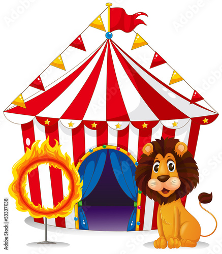 A lion and a fire ring in front of the circus tent