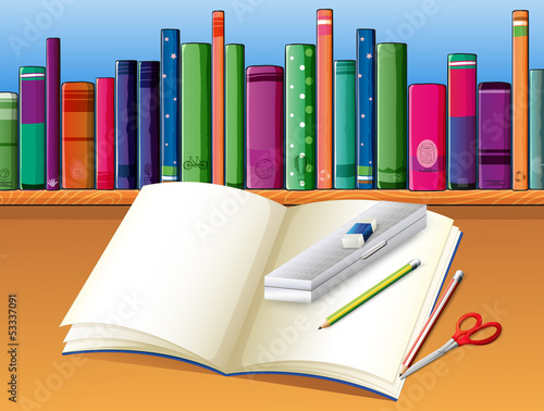 An empty notebook in front of the wooden shelf with books