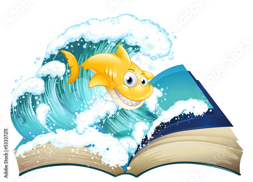 A book with an image of a shark and a wave