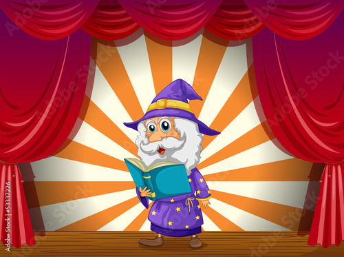 A wizard reading in the middle of the stage