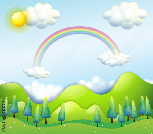 A colorful sky above the green hills
