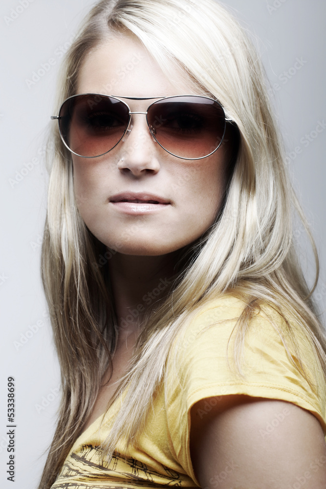 Gorgeous female model posing in sunglasses Gorgeous female model posing in sunglasses