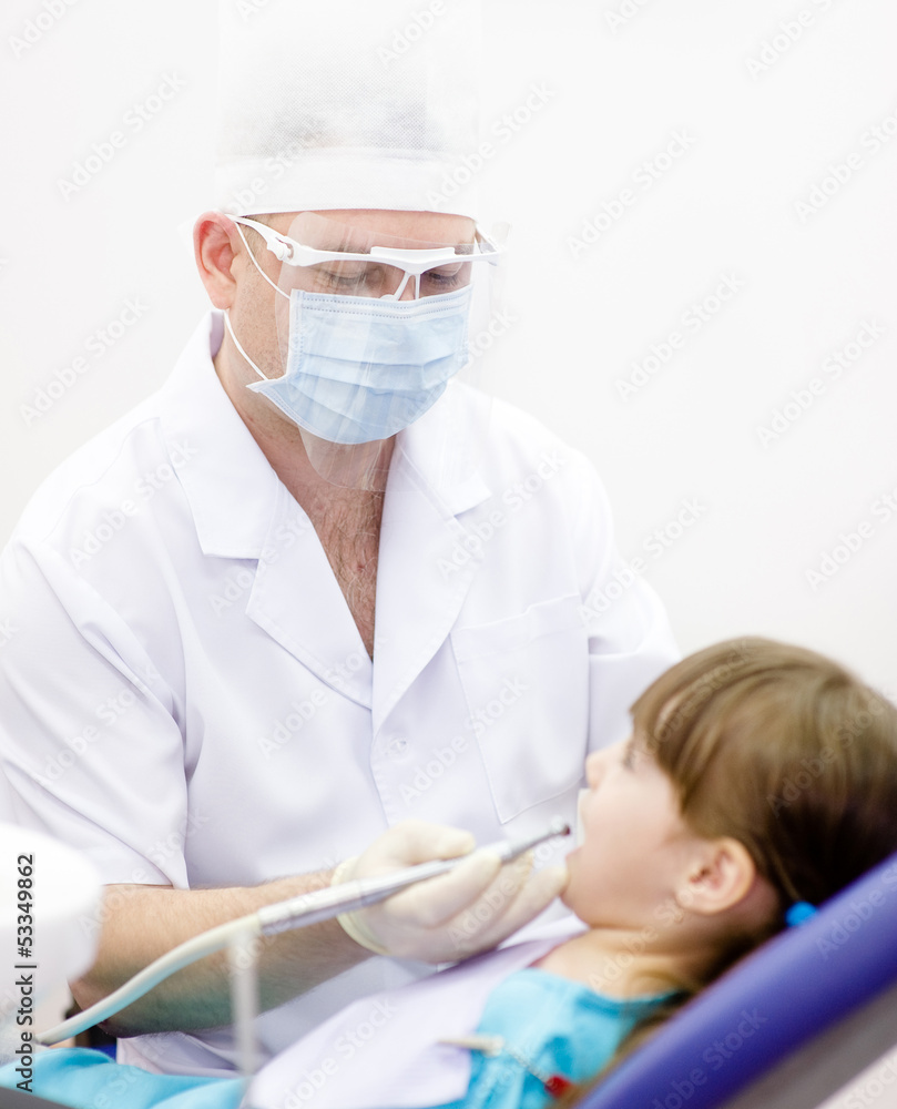 little girl with open mouth during drilling treatment little girl with open mouth during drilling treatment